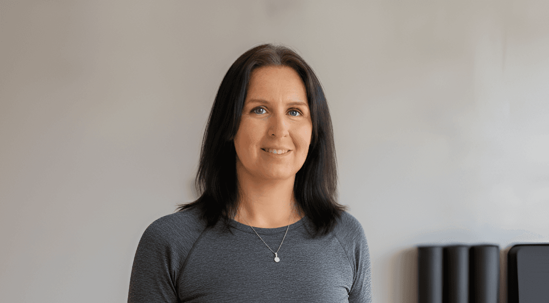 Amanda Humphreys smiling in her Pilates studio